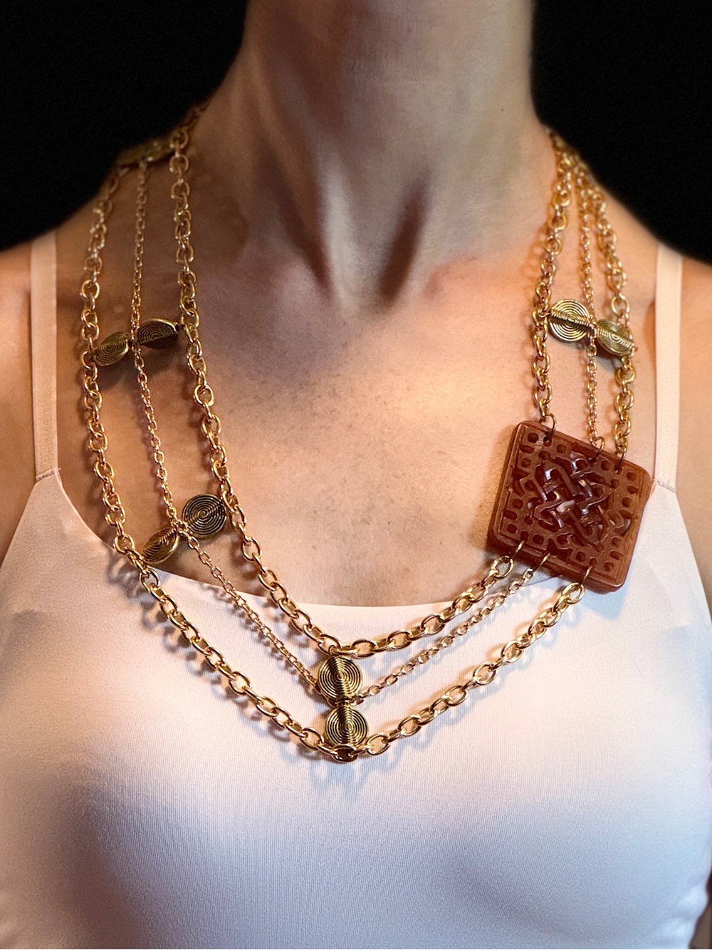 Gold Multi-Strand Necklace with Brown Carved Pendant